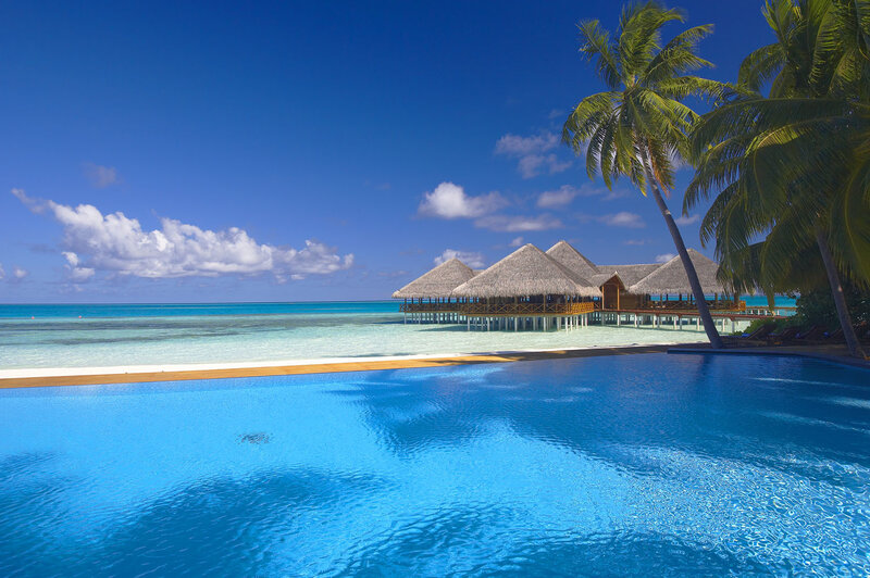 Tropical resort with pool and overwater bungalows