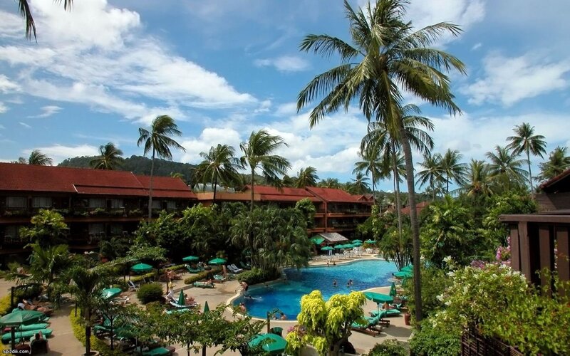 tropical resort with pool and palm trees