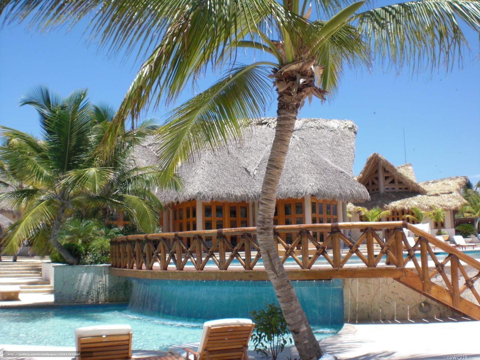 Tropical resort with pool and palm trees