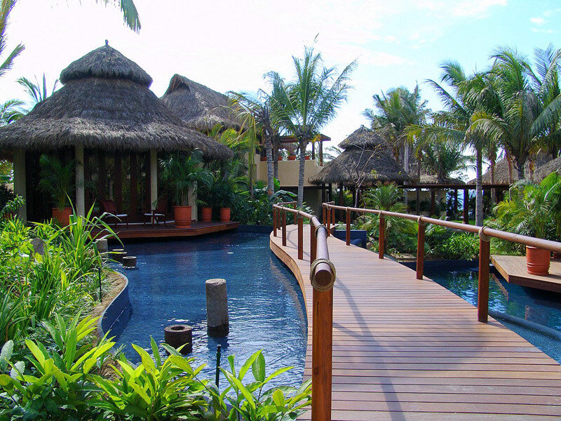 tropical resort with pool and walkway