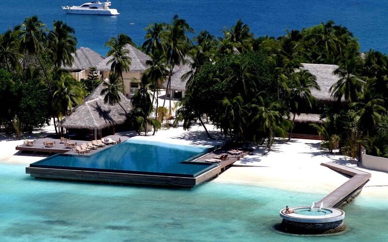 tropical resort with pool and yacht