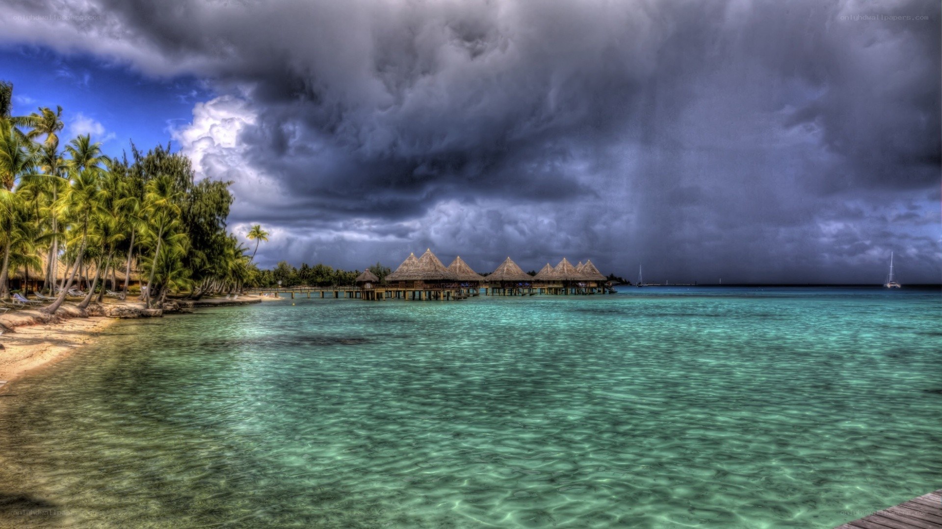 Tropical storm over resort bungalows