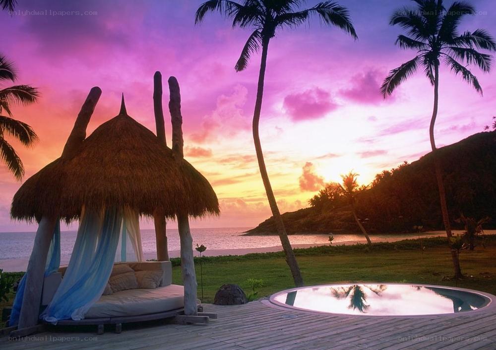 Tropical sunset by the ocean
