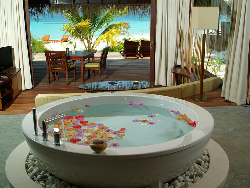 Tropical villa with flower bath