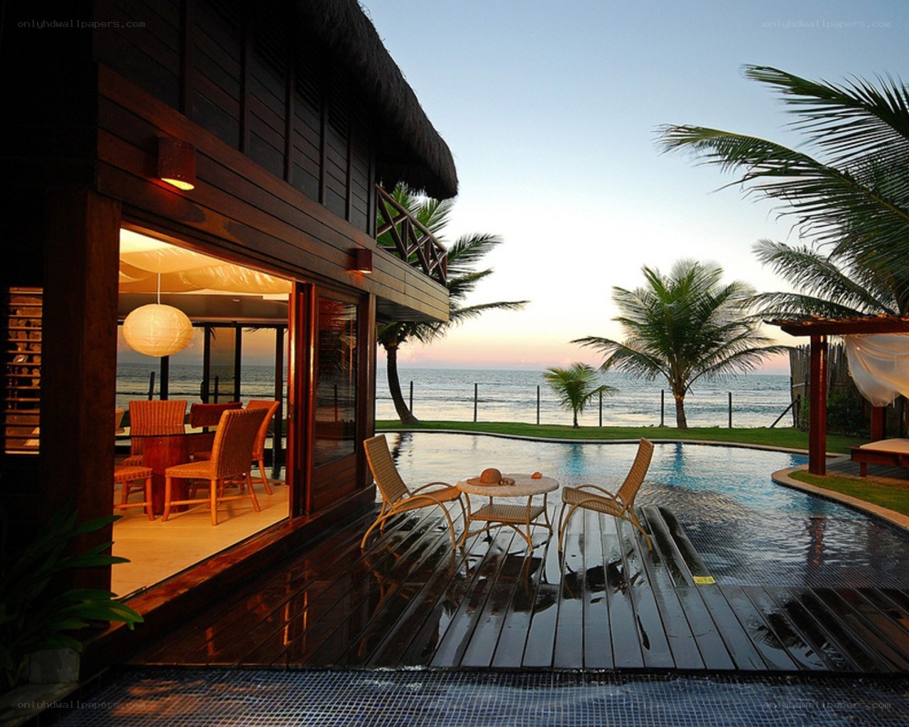 Tropical villa with pool at sunset