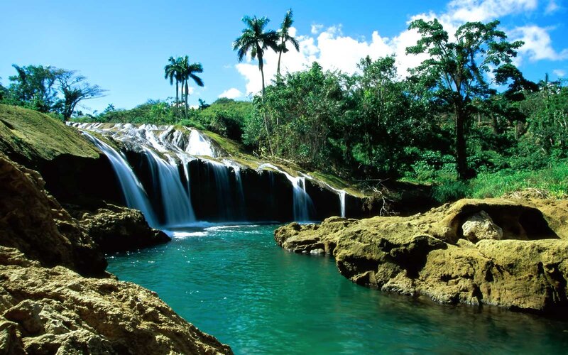 Tropical Waterfall — Blue, Serene, Afternoon, Photograph, Palm Trees, Rocks, Pool