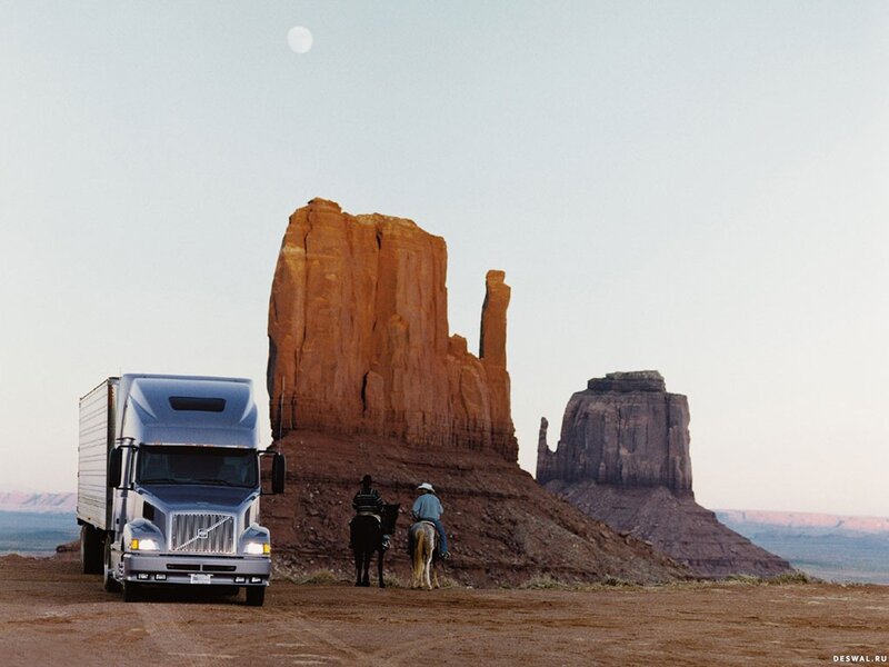 Truck and cowboys in desert