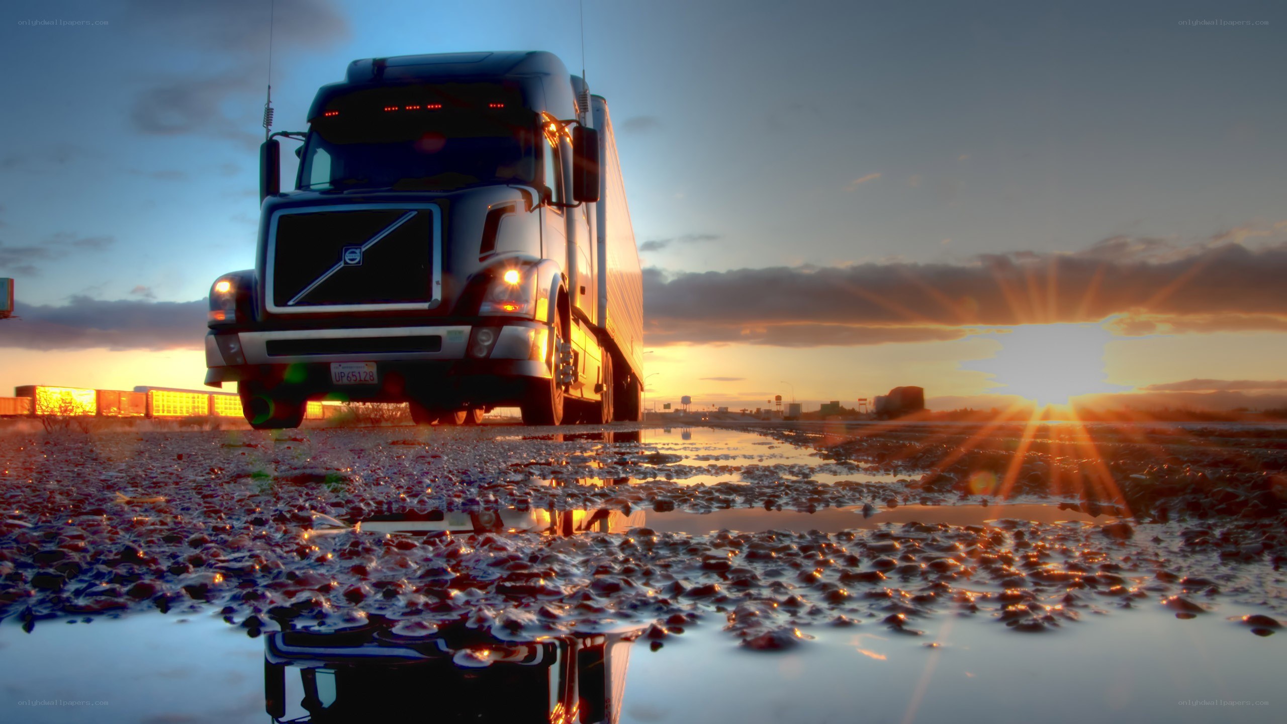 Truck at sunset in puddle