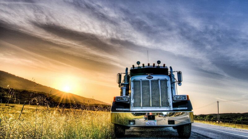 Truck at sunset on country road