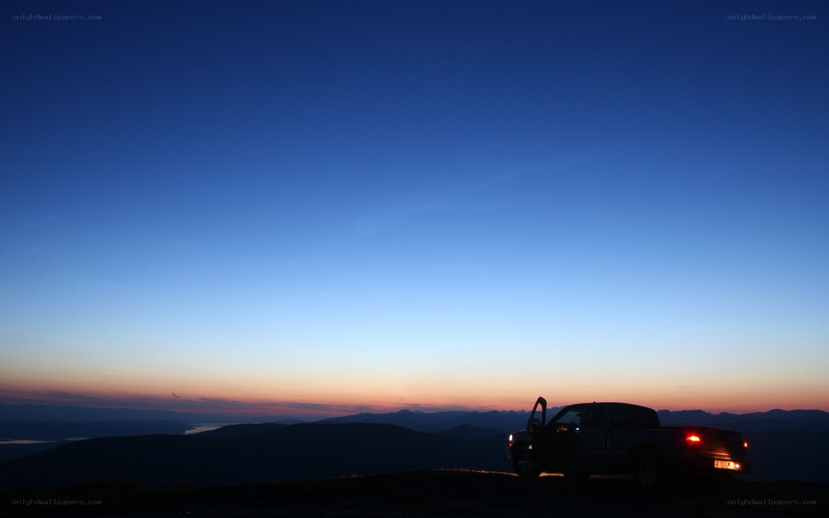 Truck at sunset on mountain