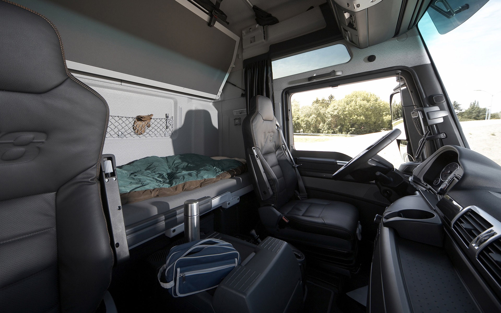 Truck cab interior with sleeper berth