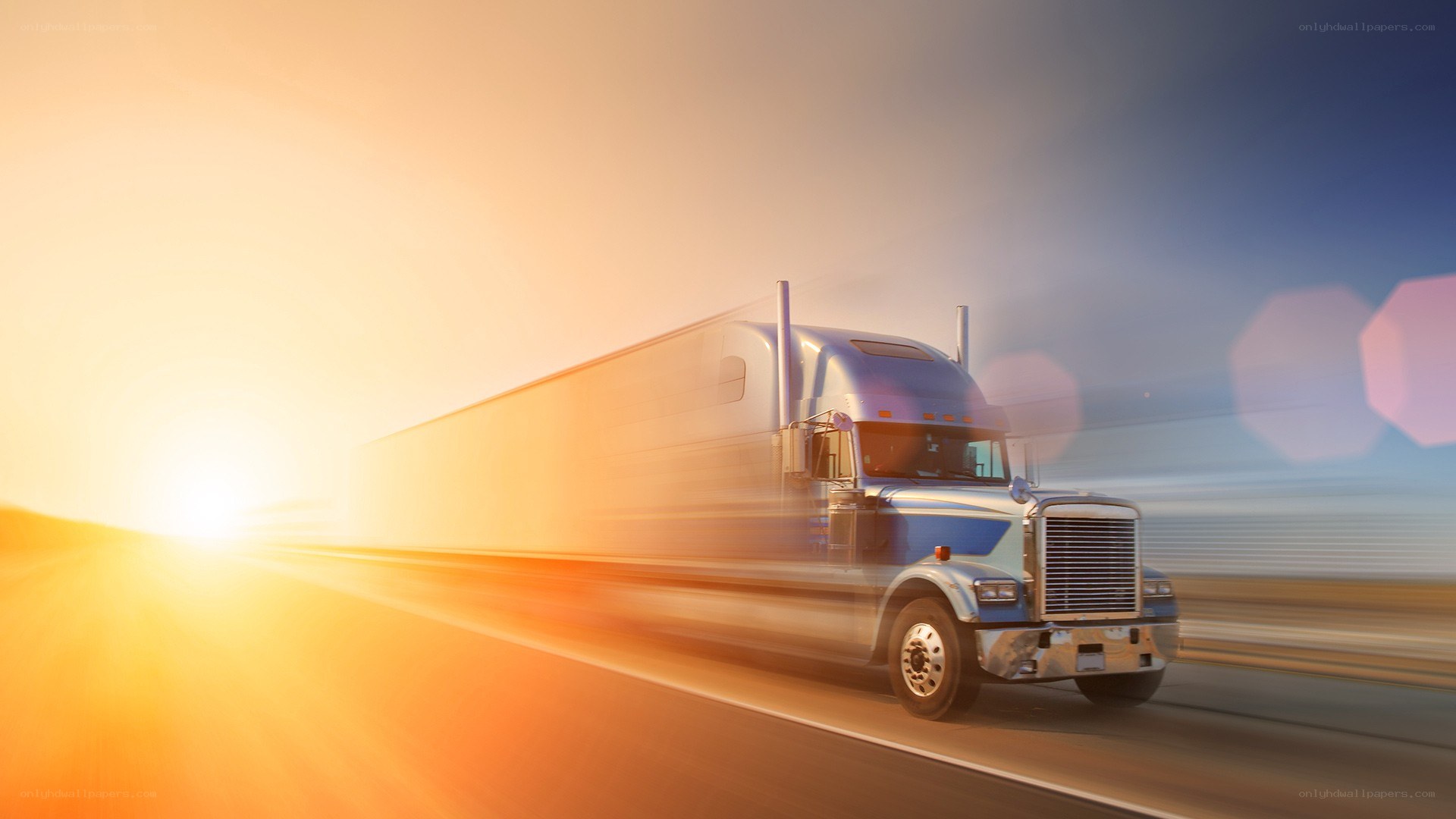 Truck driving at sunset
