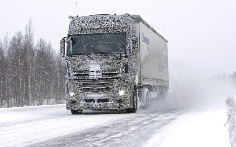 Truck driving in snowy conditions