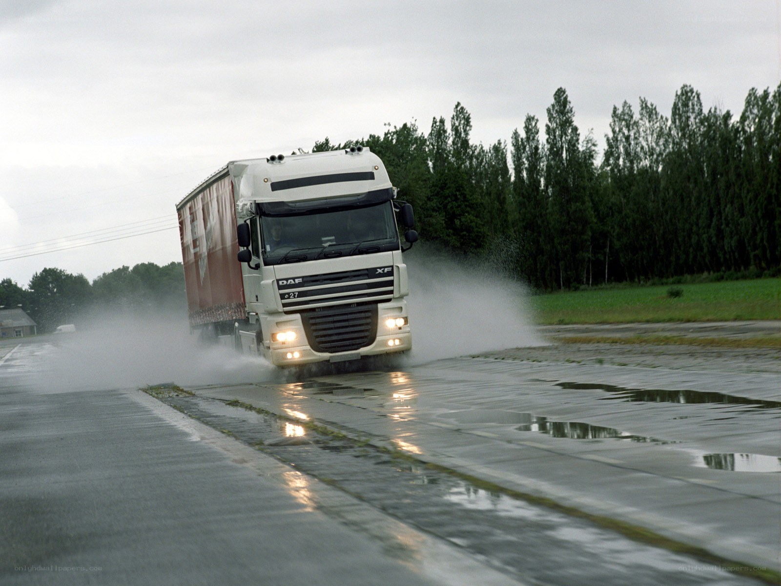 Truck driving on wet road