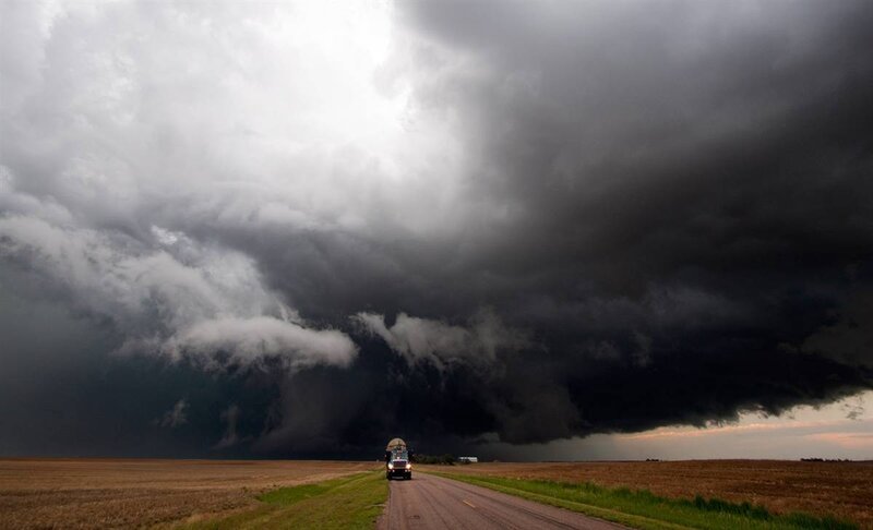 Truck facing storm cloud