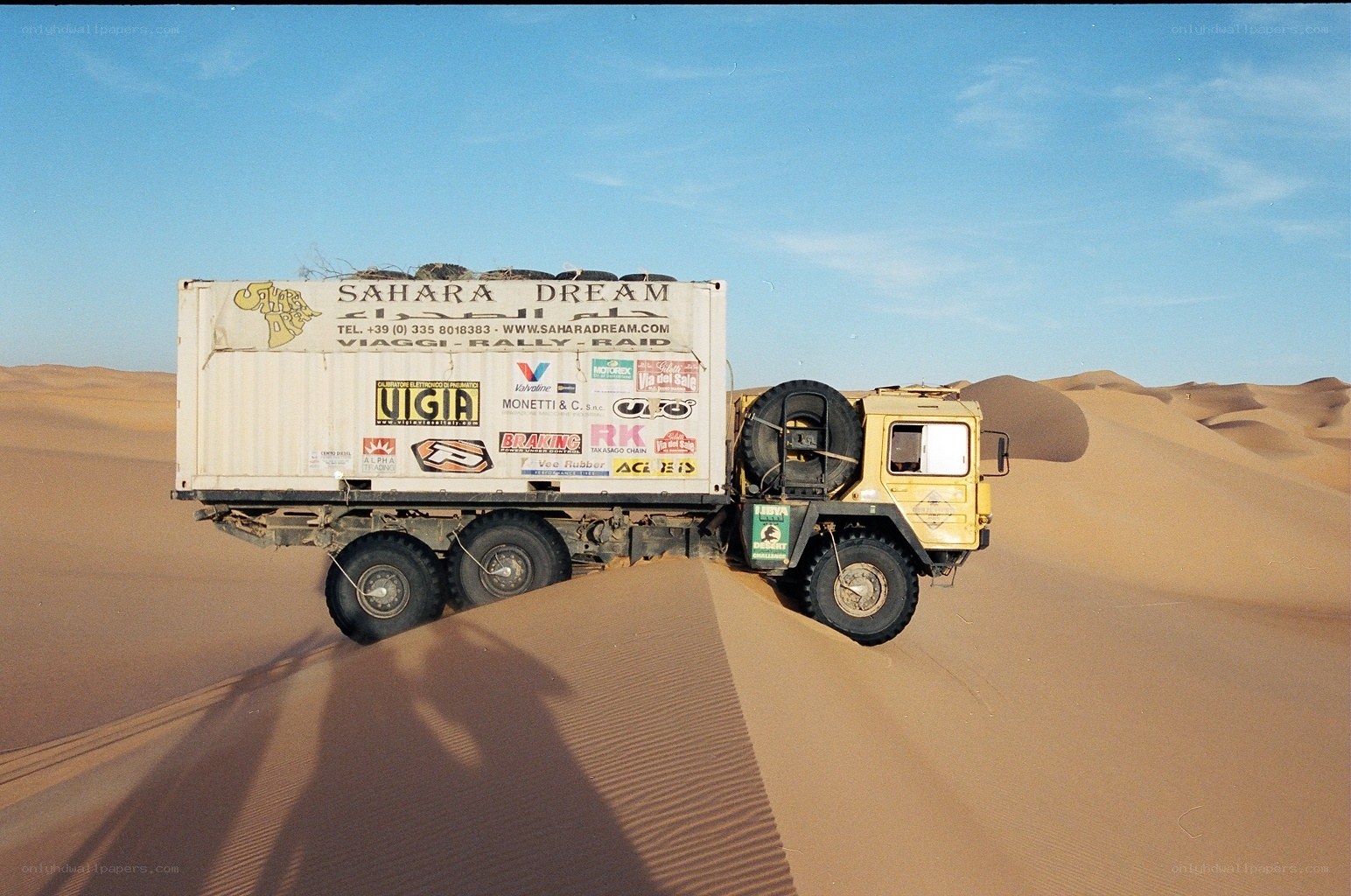 Truck in desert dunes