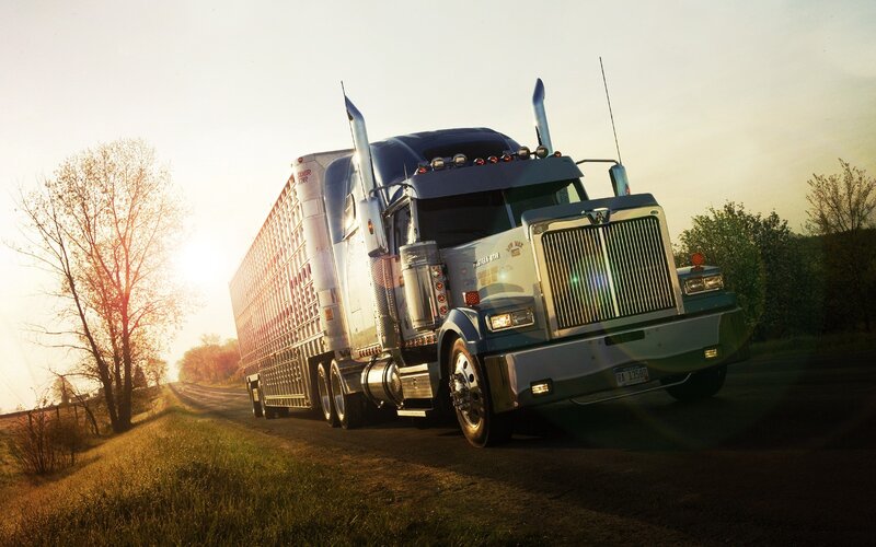 Truck on a rural road at sunset