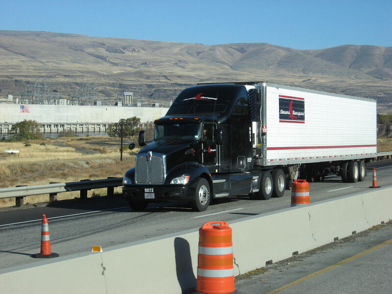 Truck on highway with mountains