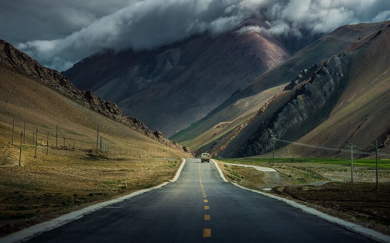 Truck on Mountain Road — Gray, Dramatic, Photograph, Mountains, Clouds