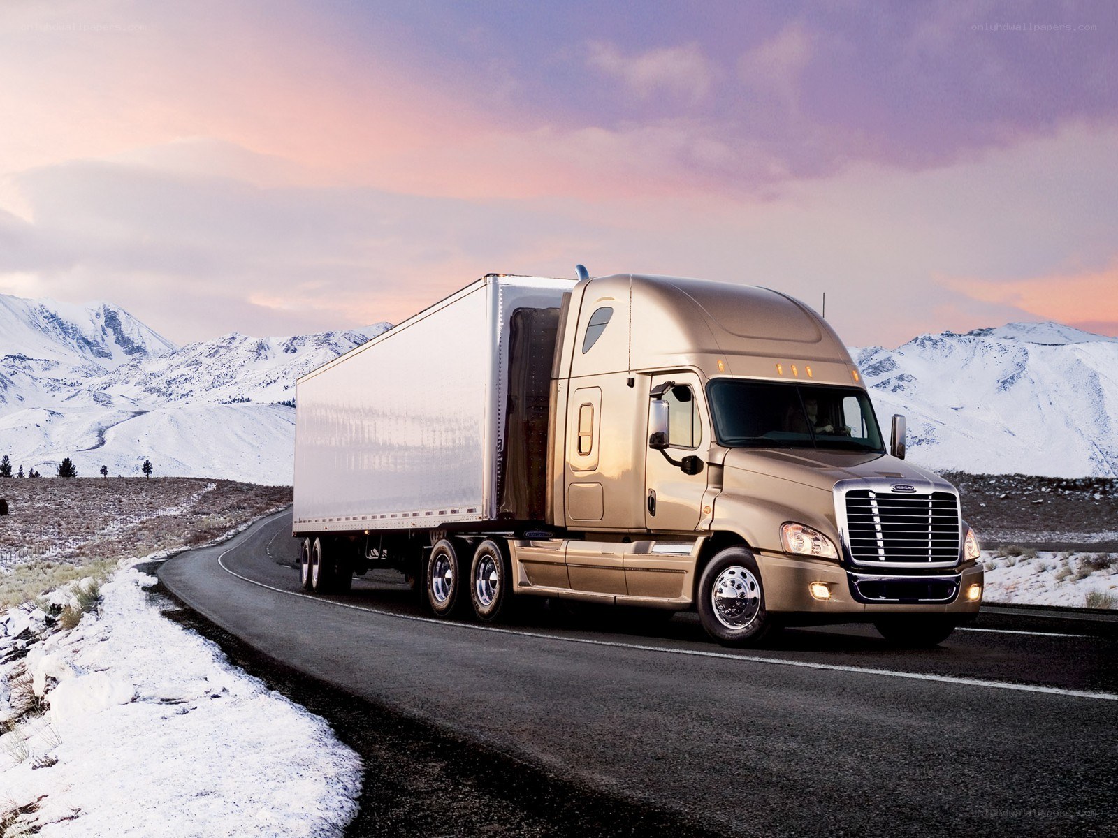 Truck on snowy mountain road