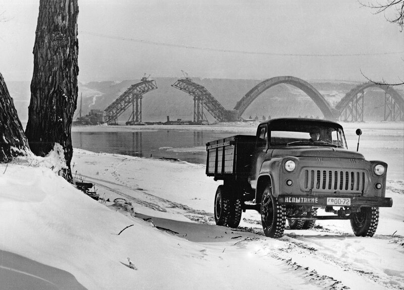 Truck on snowy riverbank