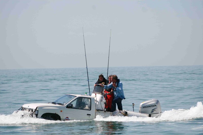 truck on water with people