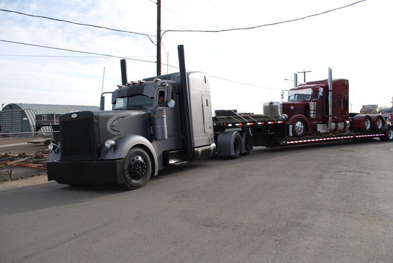 Truck transporting another truck