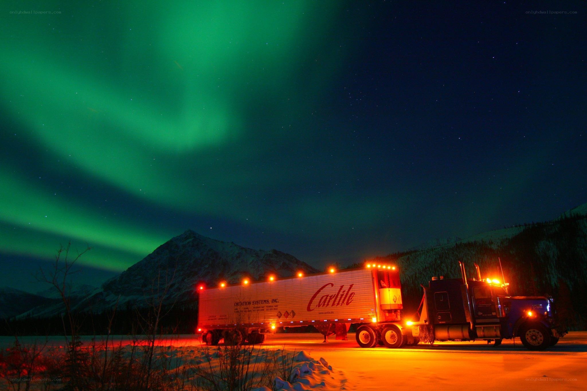 Truck under northern lights