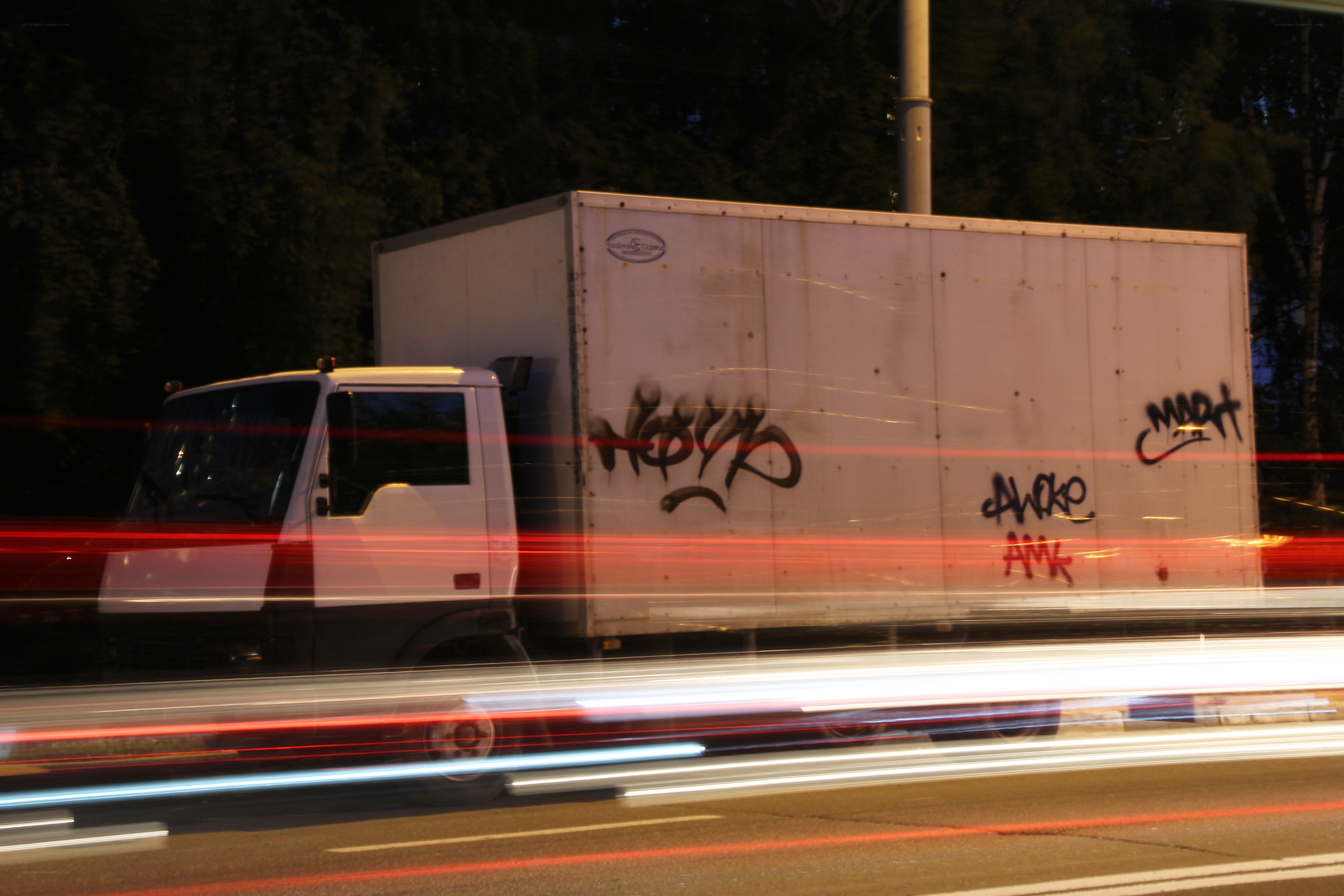 Truck with graffiti at night
