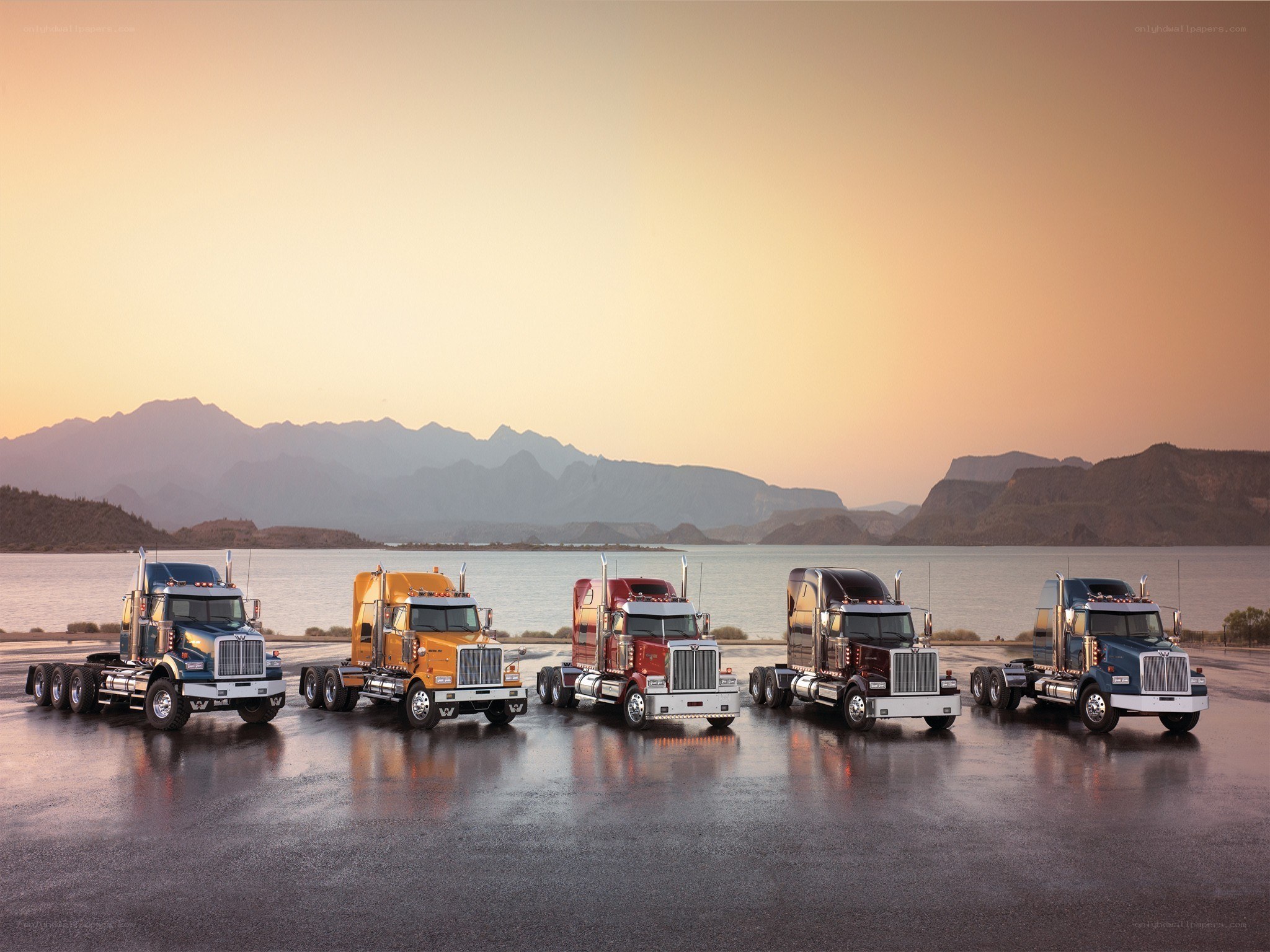trucks at sunset by water