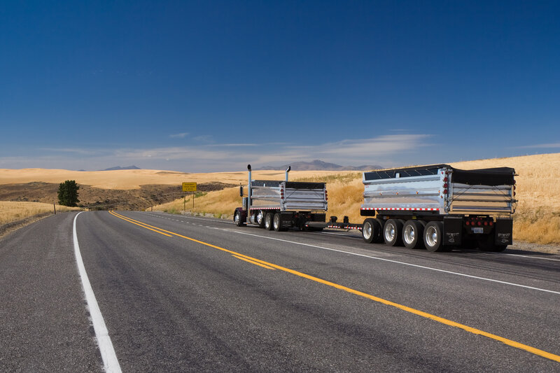 Trucks on Highway — Blue