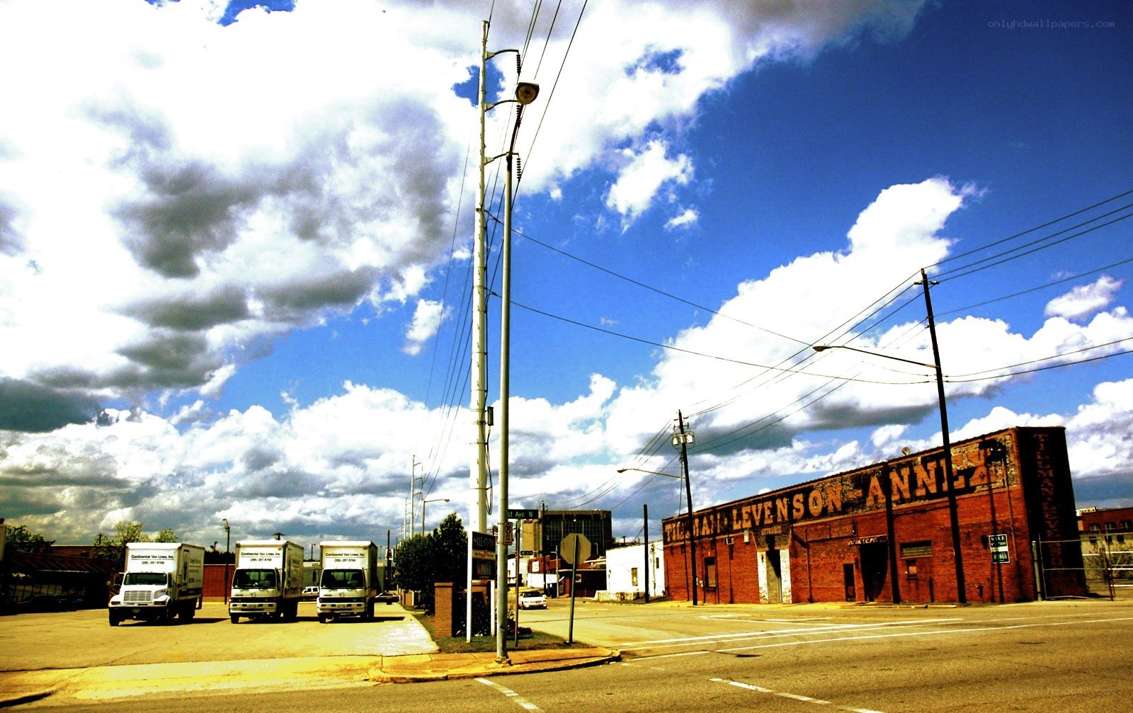 Trucks parked near brick building
