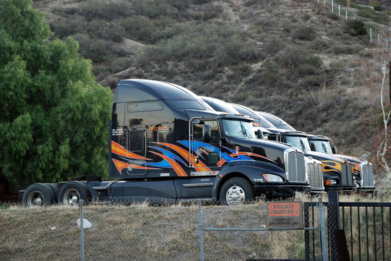 trucks parked on a hillside