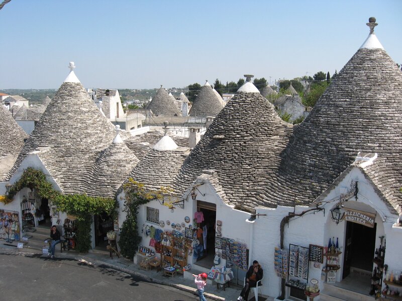 Trulli Houses in Alberobello — White, Serene, Afternoon, Photograph, People