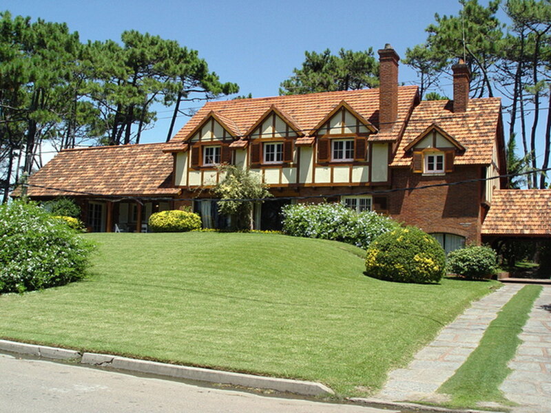Tudor-style house with green lawn