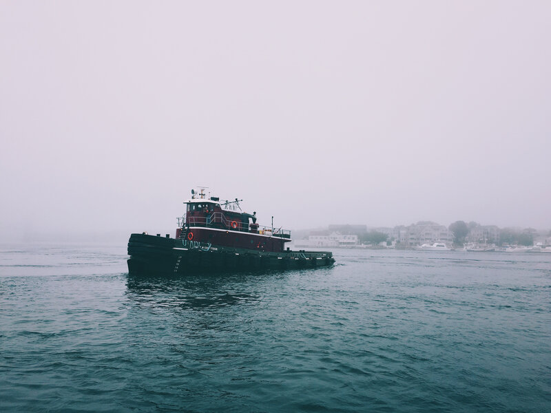 tugboat in foggy harbor