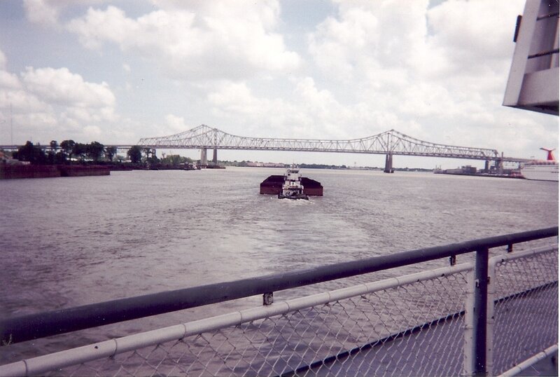 tugboat on a river with bridge