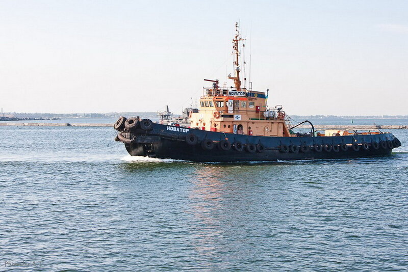 Tugboat on Water — Blue