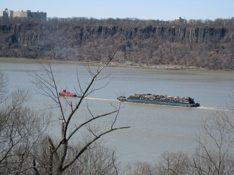 Tugboat pulling barge on river