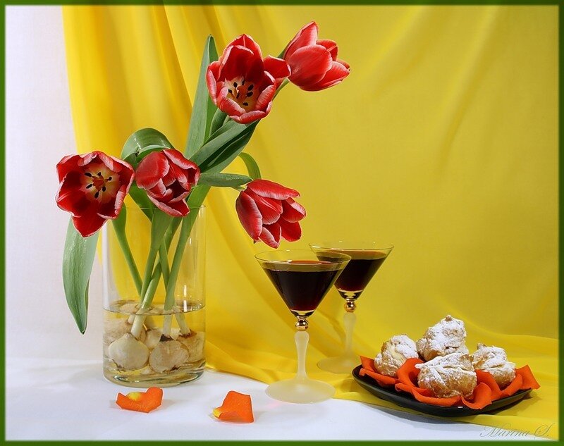 Tulips and dessert on yellow