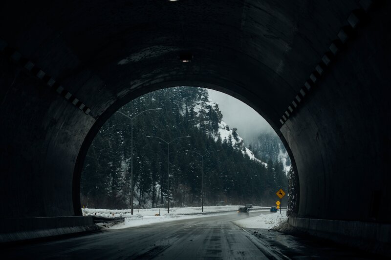 tunnel exit in snowy mountains