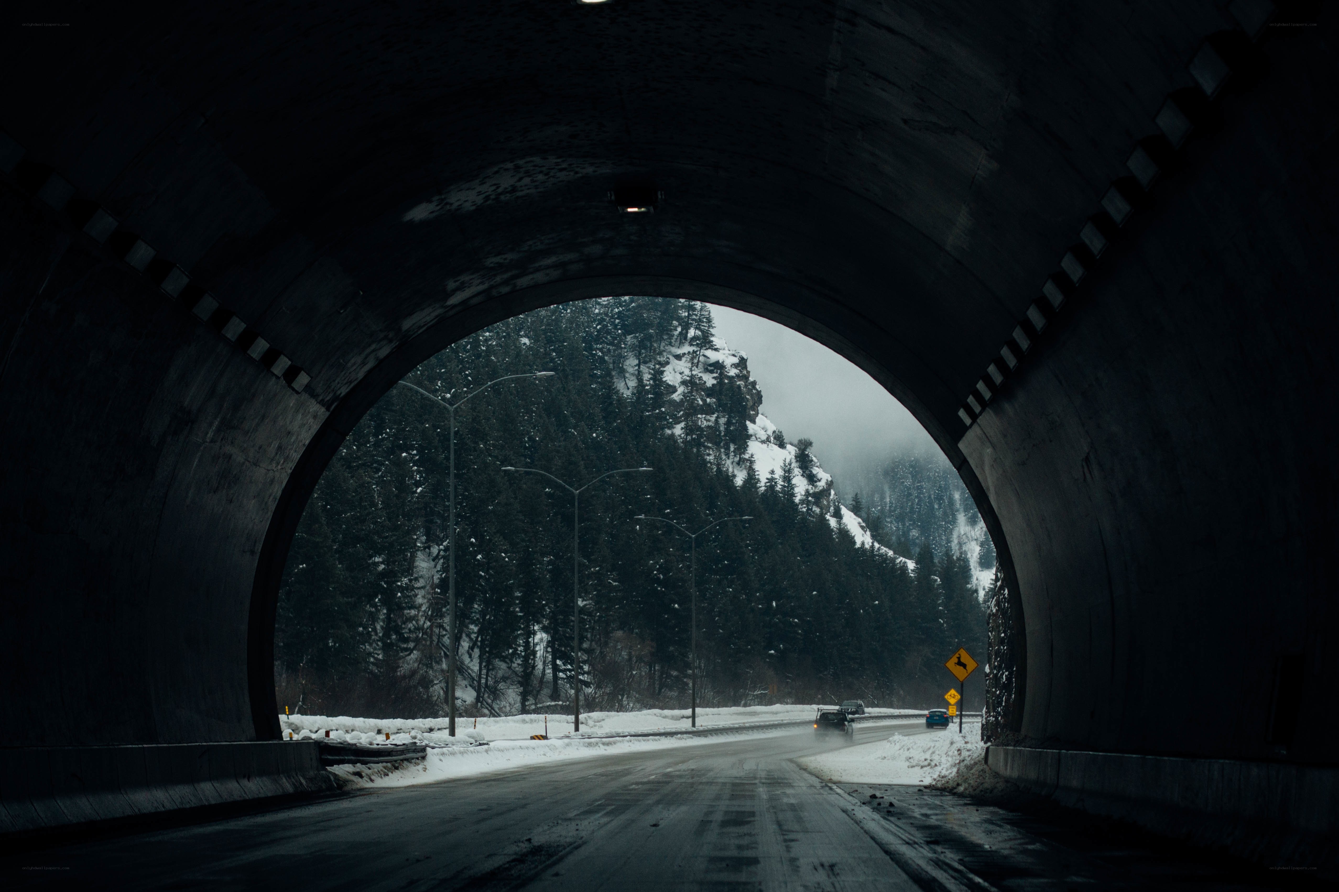 tunnel exit in snowy mountains