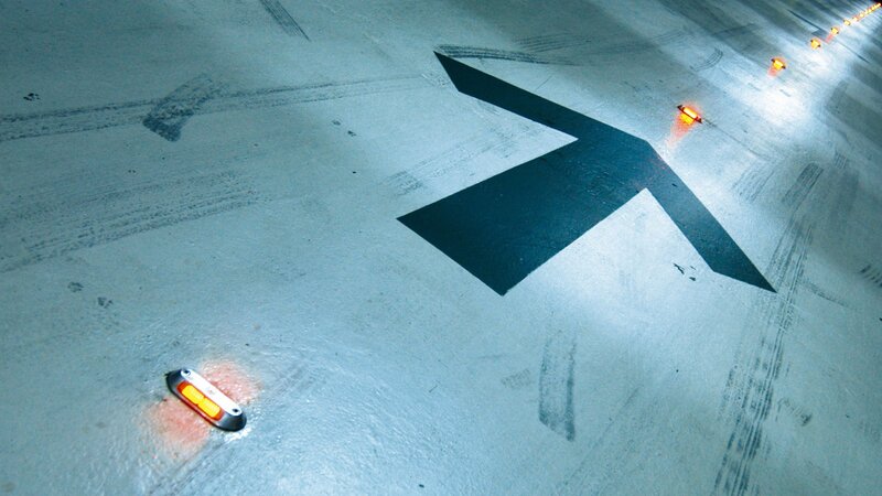 tunnel floor with directional arrow