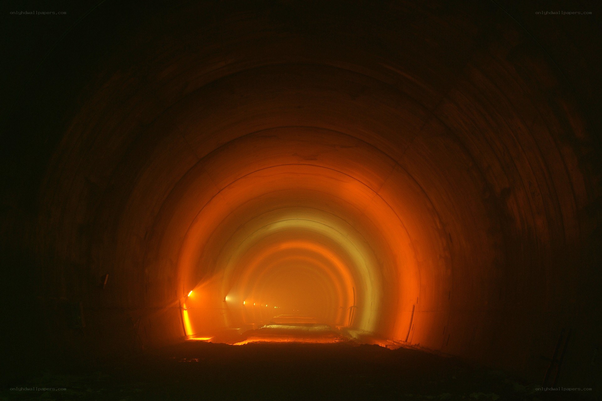 tunnel lit by orange lights