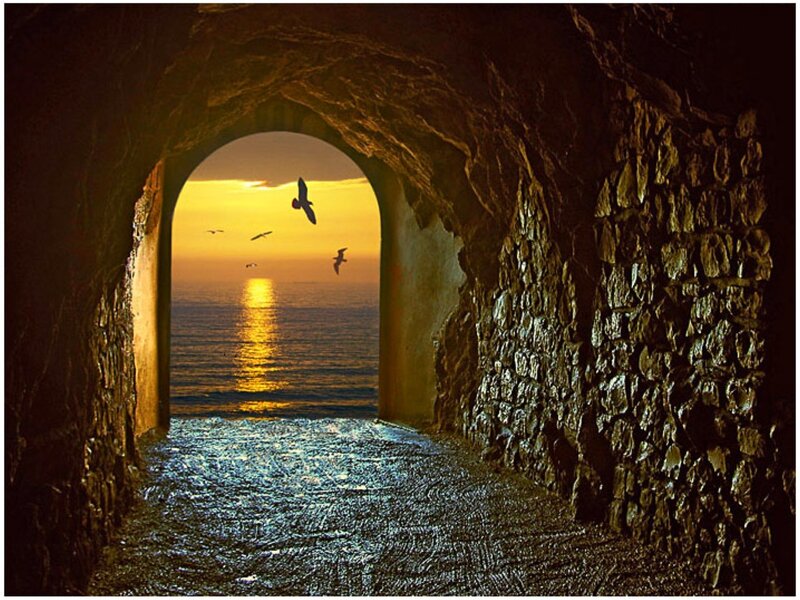 tunnel view of sunset over sea