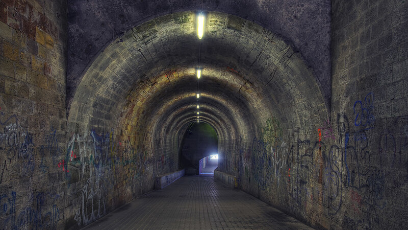 tunnel with graffiti and lights