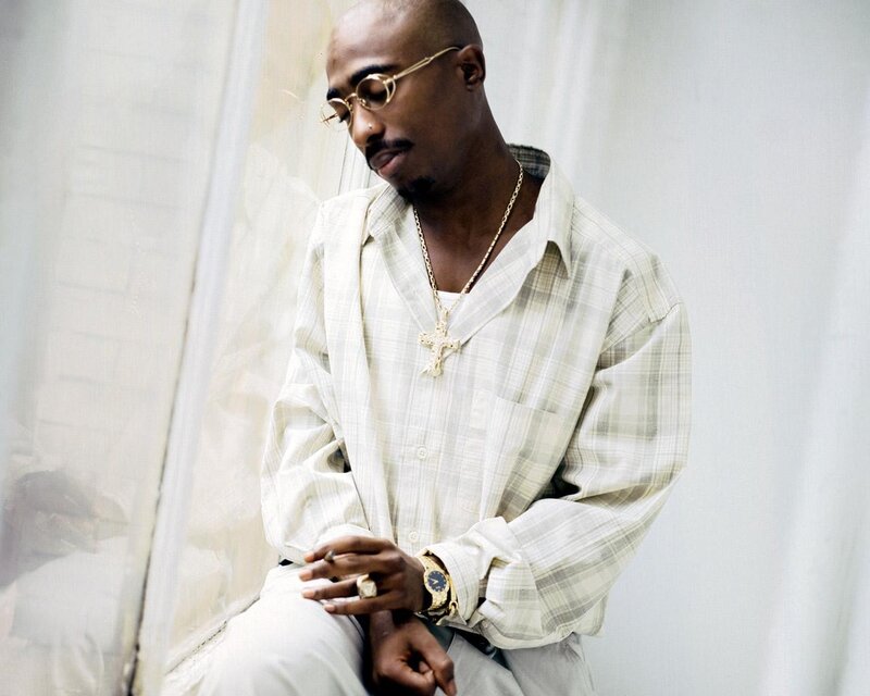 Tupac Shakur in plaid shirt