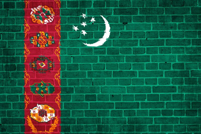 Turkmenistan flag on brick wall