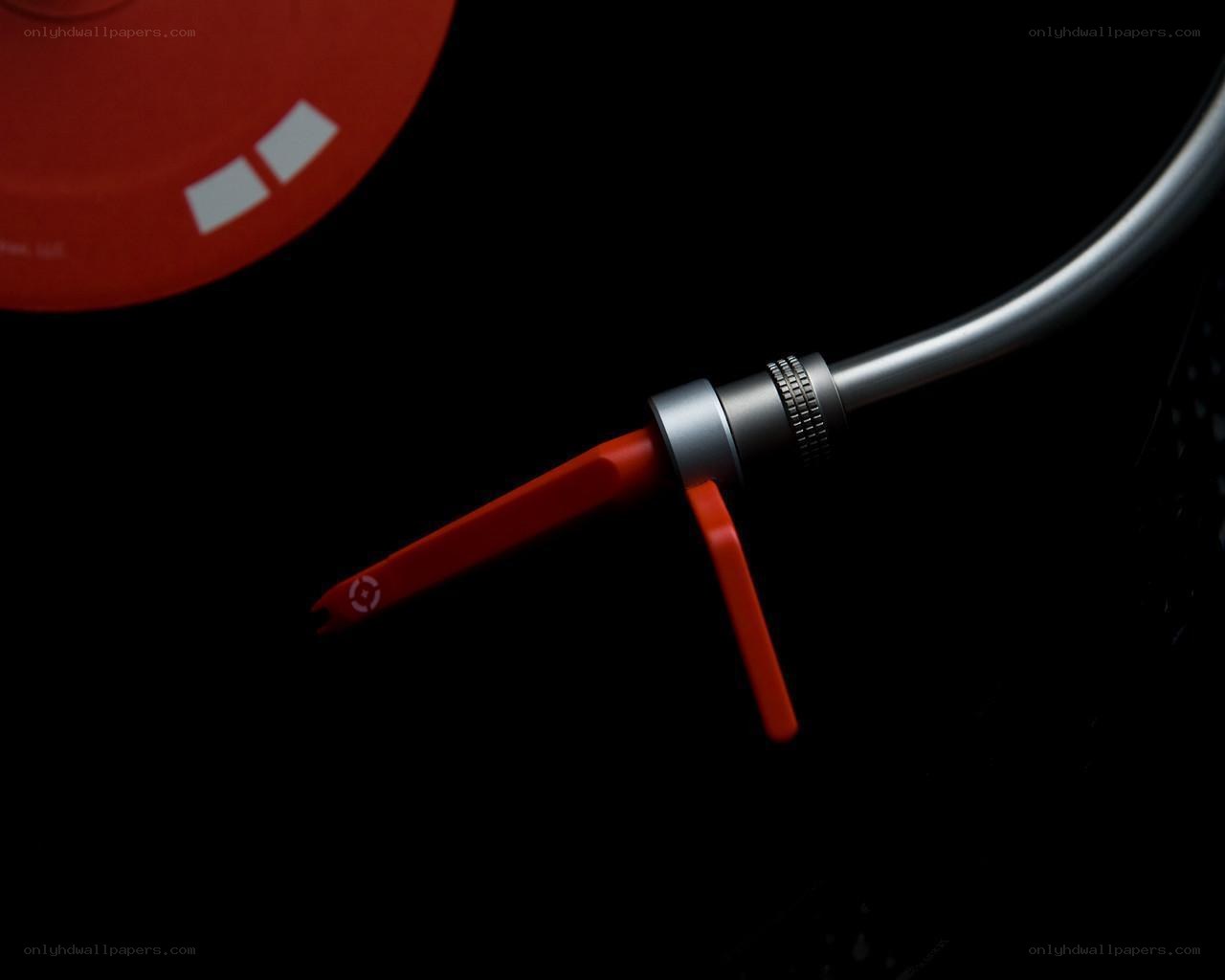 turntable needle on red vinyl