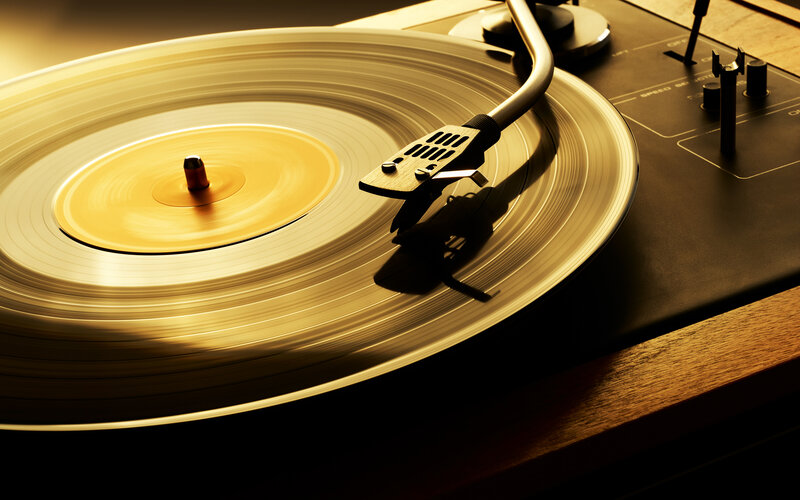 Turntable Playing Vinyl — Gold